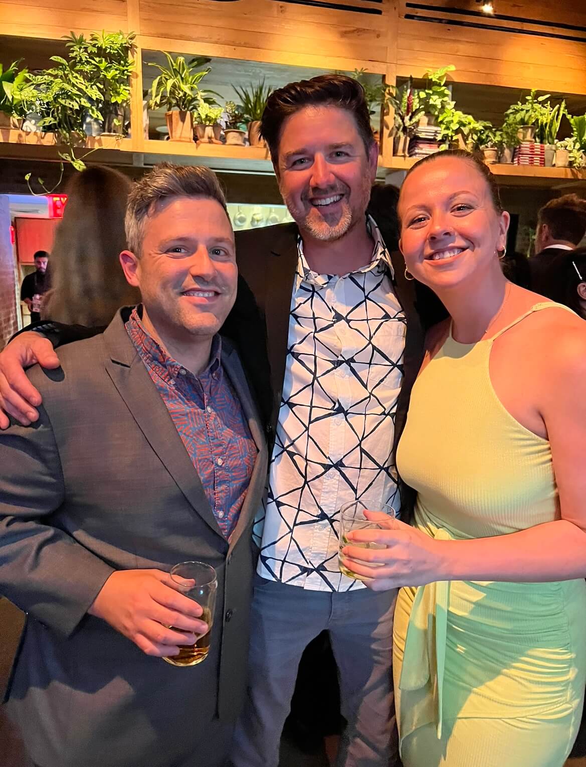 Eli Rotholz, Nick Pitcavage, and Samantha Thornhill enjoying cocktails ahead of the AICP Gala